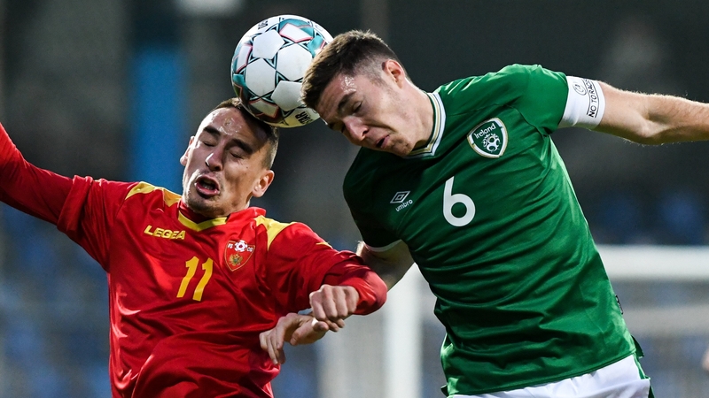 Conor Coventry (R) rises with Danilo Pesukic at Gradski Stadion in Podgorica