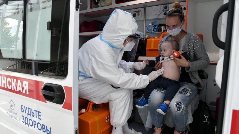 A medical worker admits a child to a Covid-19 facility of Krasnodar's Children's Infectious Diseases Hospital