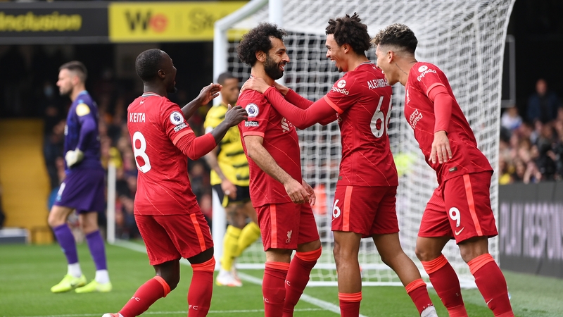 The Egyptian takes the congratulations from his team-mates after he delivered more magic at Vicarage Road