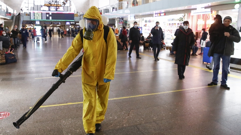 A worker disinfects Moscow's Leningradsky railway station