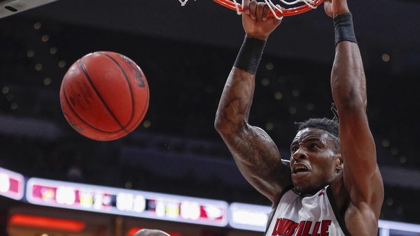 Aidan Igiehon #22 of the Louisville Cardinals dunks the ball in November 2019