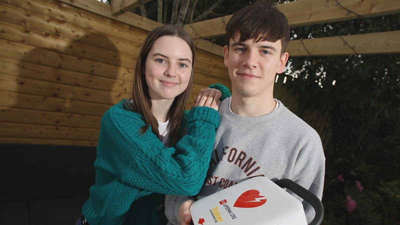 Lucy King and her brother Thomas, who ran to the get the nearest defibrillator, which her family said helped save her life (Pic: BHF NI)