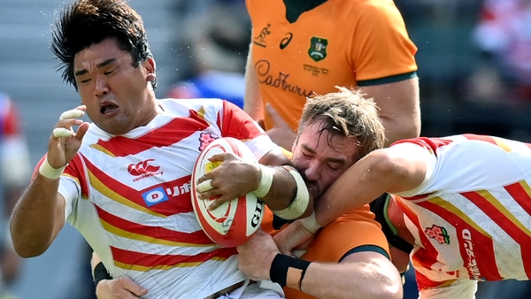 Japan's Gu Jiwon carries during their defeat to Australia