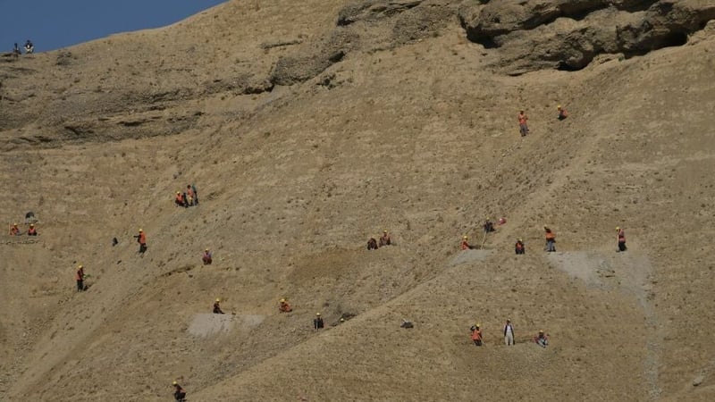 Afghan people working in a field in Dasht-e-Padula, southern Kabul