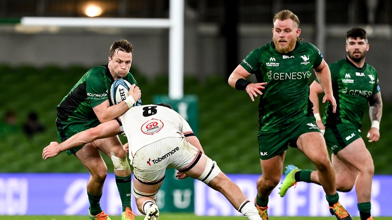 Jack Carty of Connacht is tackled by David McCann of Ulster