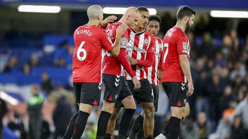 Will Smallbone is consoled by team-mates after his penalty miss