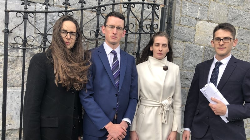 Ammi, Enoch, Kezia and Isaac Burke outside court