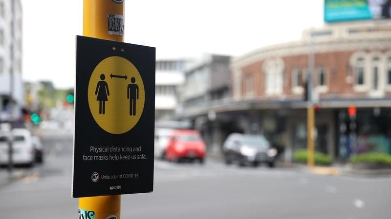 A sign encouraging social distancing is seen at Newmarket in Auckland