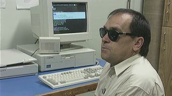 Paul Higgins with text to speech reader at Galway City Library.