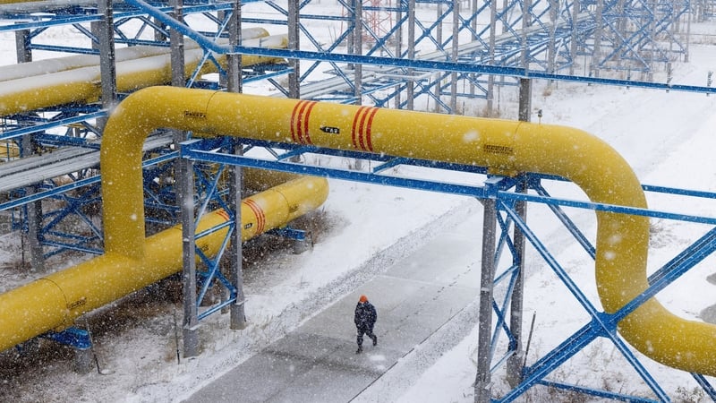 A worker walks under pipes connected to the Power of Siberia gas pipeline in Russia. Photo: Andrey Rudakov/ Bloomberg via Getty Images