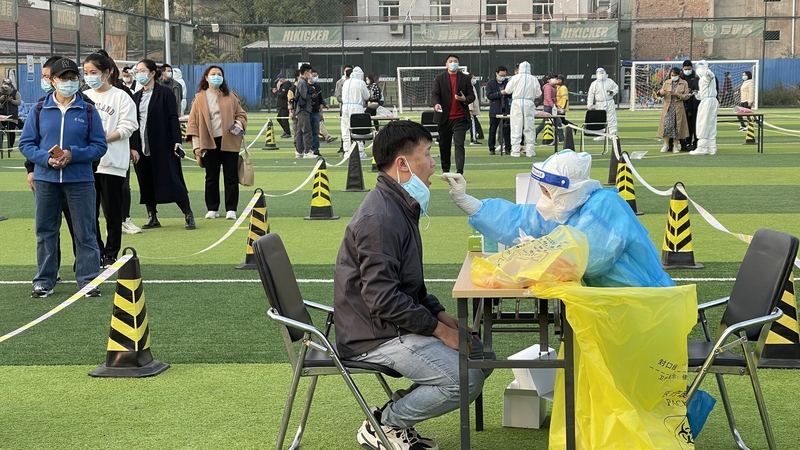 People queue up for Covid-19 nucleic acid testing at Haidian District in Beijing, China