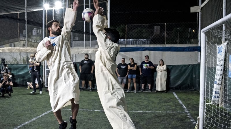 A member of the Maradonian Church simulates Diego Maradona's famous goal against England