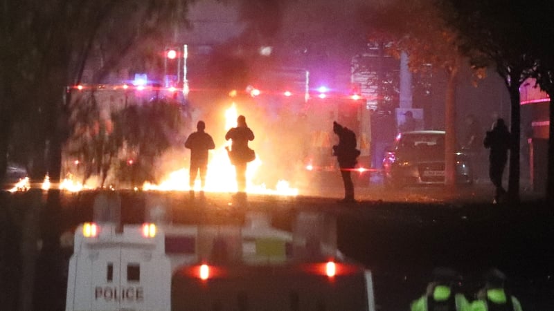 Missiles and fireworks being thrown at police on Lanark Way in Belfast tonight