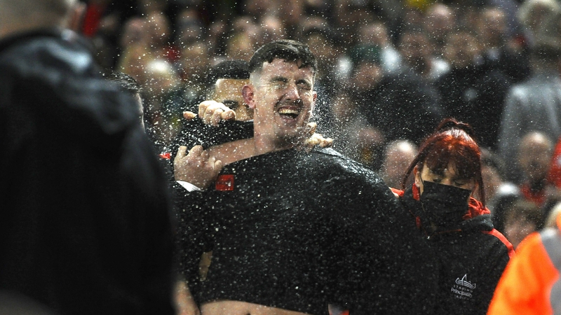 The pitch invader is escorted away by security at the Principality Stadium
