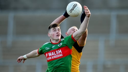 Gowna's Ryan Brady contests possession with Ramor United's Laurence Caffrey