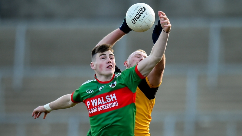 Gowna's Ryan Brady contests possession with Ramor United's Laurence Caffrey