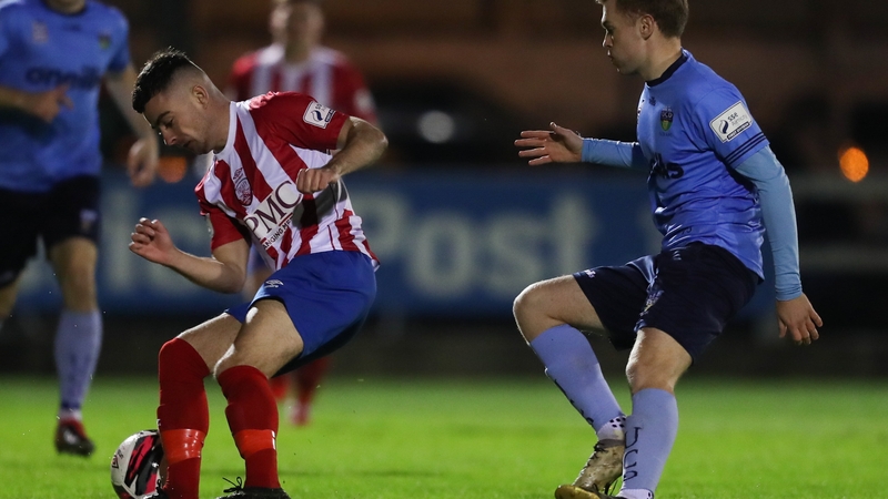 Stephen Christopher of Treaty United in action against Paul Doyle of UCD