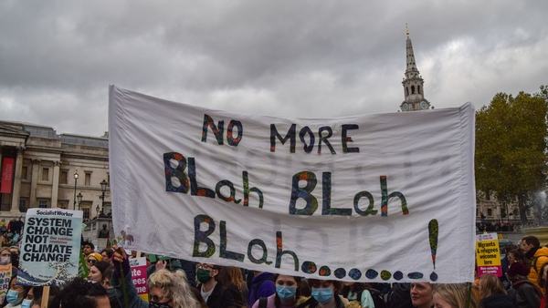 Protesters hold a banner during the demonstration in Trafalgar Square, London, coinciding with the COP26 conference