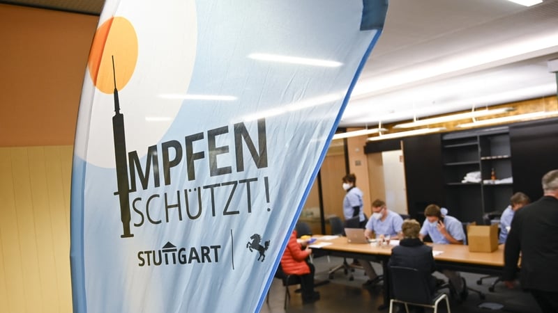 People wait for a Covid-19 vaccine at a clinic in Stuttgart, southern Germany