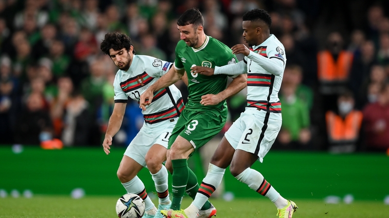 Enda Stevens of Republic of Ireland is tackled by Goncalo Guedes and Nélson Semedo
