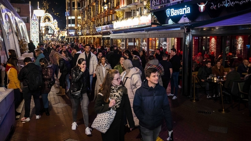 People queuing in front of a cafe in the city centre in Eindhoven