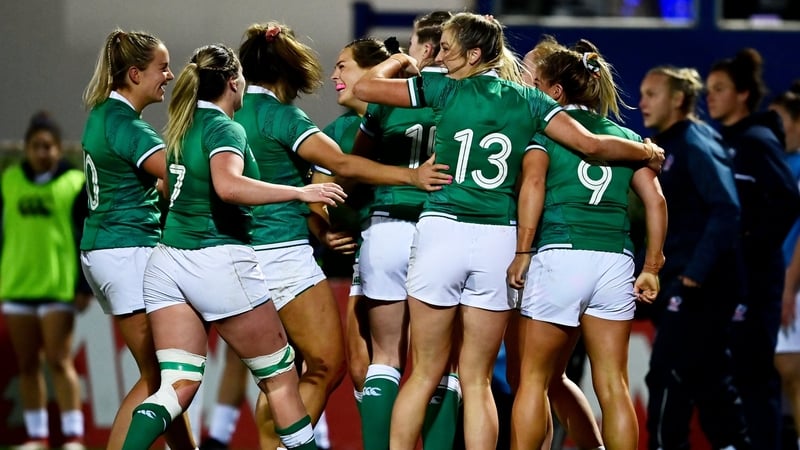 Ireland's players celebrate the opening try of the game from Beinhinn Parsons.