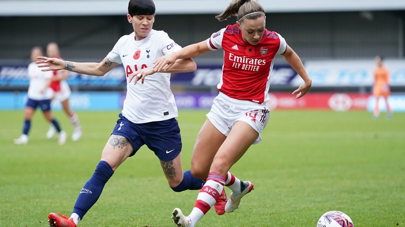 Tottenham Hotspur's Ashleigh Neville (L) and Arsenal's Katie McCabe battle for the ball