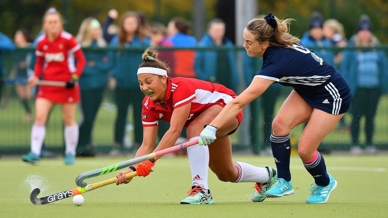 Old Alex's Lena Tice under pressure from UCD's Grace Keane (Photo: Adrian Boehm)