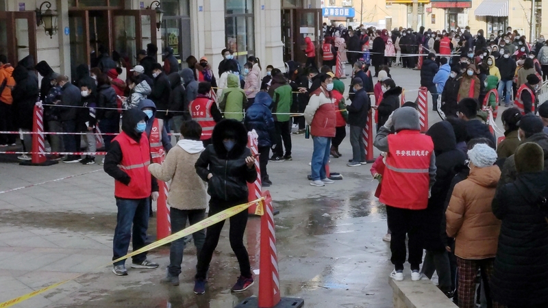 People in the city of Dalian queue for Covid-19 tests