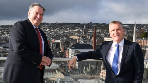 Denis Collins, ActionZero's CEO, left and Minister for Public Expenditure, Michael McGrath, at the opening of the company's new office