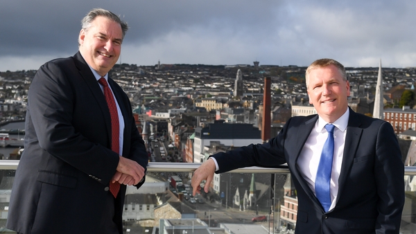 Denis Collins, ActionZero's CEO, left and Minister for Public Expenditure, Michael McGrath, at the opening of the company's new office