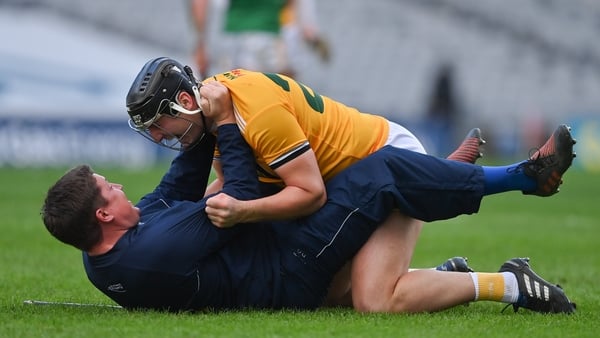 Domhnall Nugent and Antrim manager Darren Gleeson embrace after their 2020 Joe McDonagh Cup final win