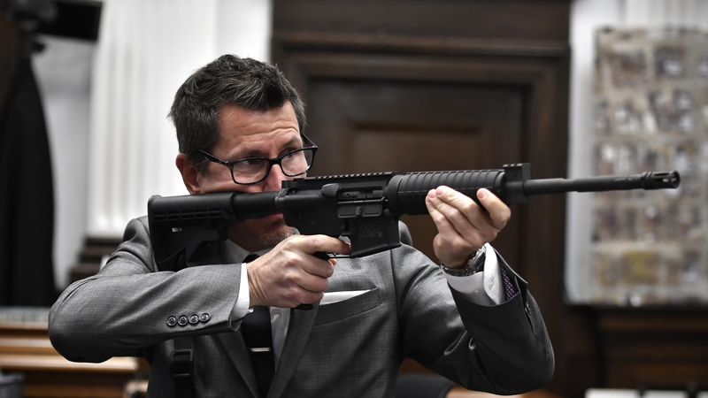 District Attorney Thomas Binger raised the AR15 in court to demonstrate how he claimed Kyle Rittenhouse instigated the clashes