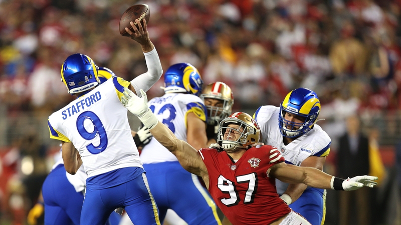 Nick Bosa (No 97) tries to block Matthew Stafford's pass