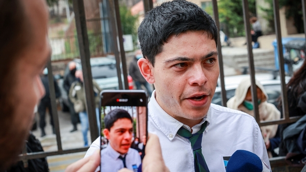 Seán Binder answering questions outside court today