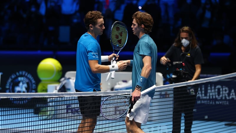 Casper Ruud is congratulated by Andrey Rublev