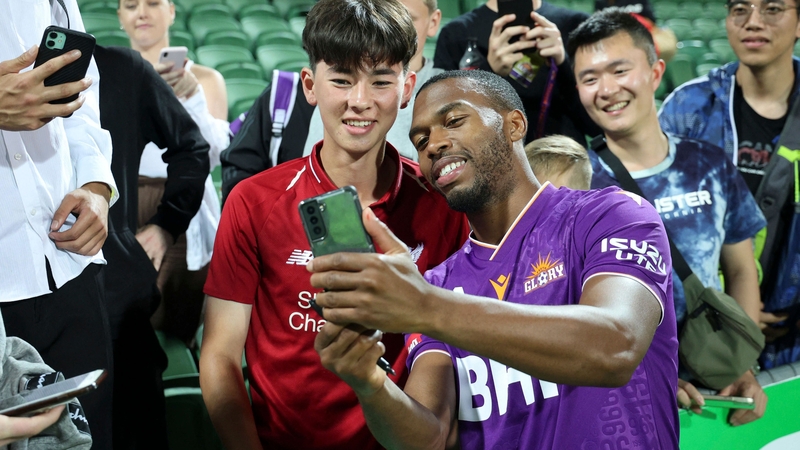 Daniel Sturridge poses for a selfie with a fan after he made his debut for Perth Glory