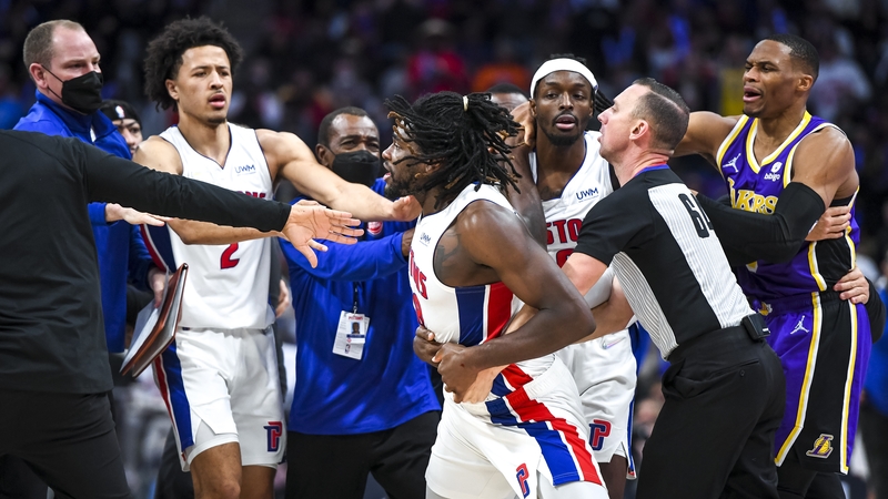 Isaiah Stewart #28 of the Detroit Pistons is restrained