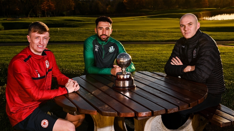 Chris Forrester, Roberto Lopes and Georgie Kelly pose with the award