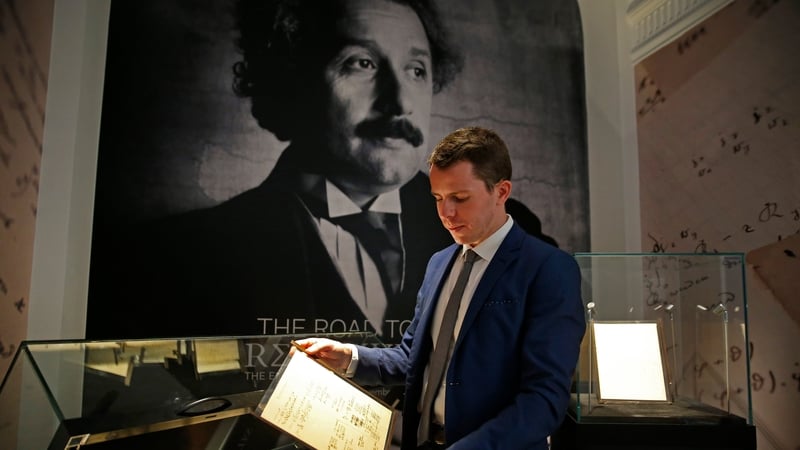 Vincent Belloy poses with the manuscript written jointly by Albert Einstein and Michele Besso between June 1913 and early 1914