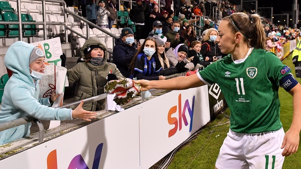Republic of Ireland captain Katie McCabe gives her boots to Aoibhe Buckley of Clondalkin Celtic