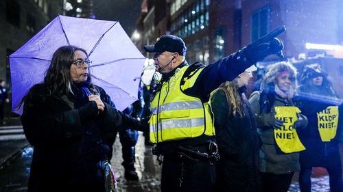 Protesters outside the Ministry of Justice at The Hague in the Netherlands this evening
