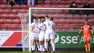 Dara Keane is mobbed after scoring for UCD