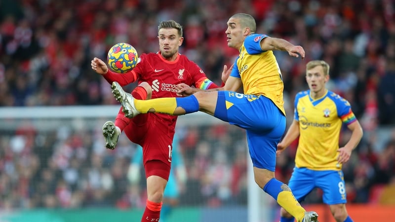 Jordan Henderson of Liverpool battles for possession with Oriol Romeu of Southampton