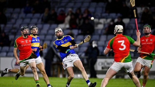 Stephen Bergin of Clough-Ballacolla scores a point despite the efforts of Liam Ryan and James Peare of Rapparees