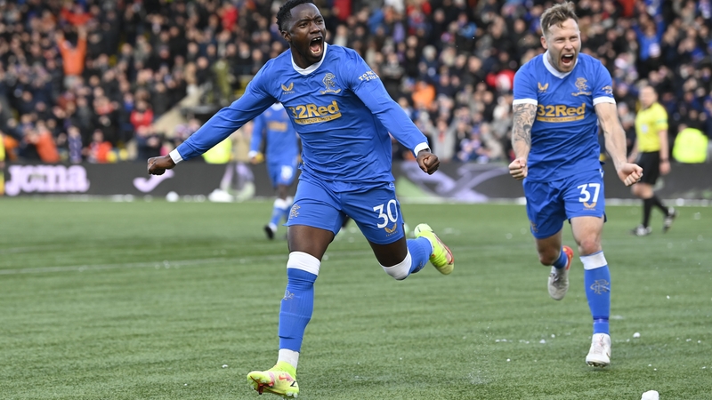 Sakala (left) and Scott Arfield celebrate the third goal