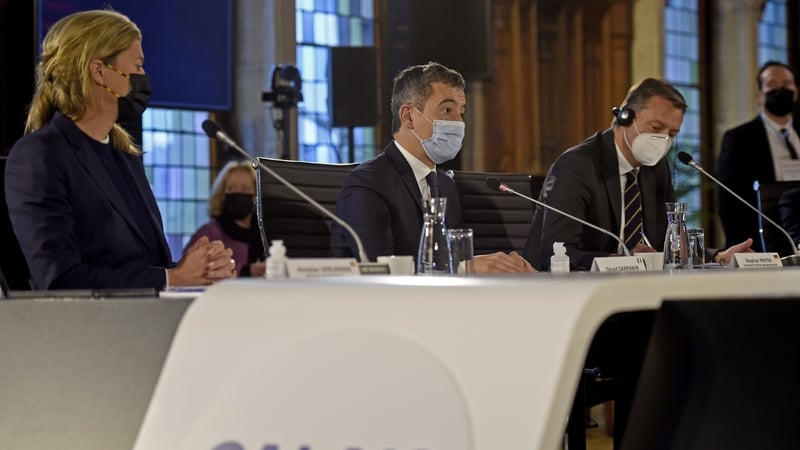 French Interior Minister Gerald Darmanin (C) speaks next to Belgium's Interior Minister Annelies Verlinden at the meeting