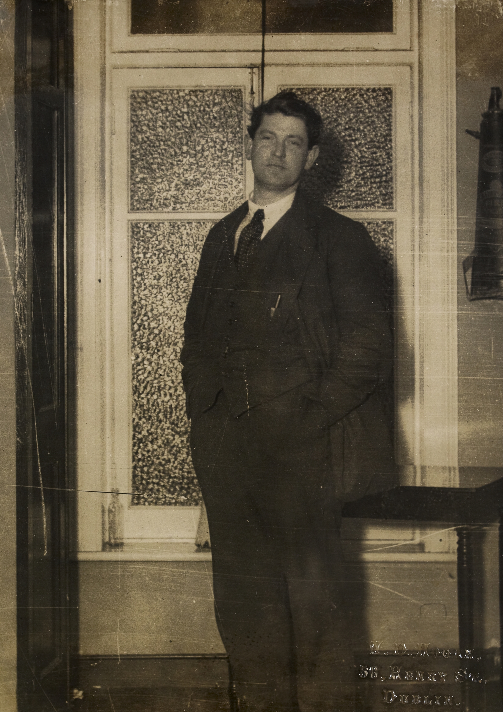 An exhausted Michael Collins photographed at the Gresham Hotel, the night of the vote to ratify the Treaty. Unusually for Collins, he is happy to be photographed at an unguarded moment. Credit: National Library of Ireland