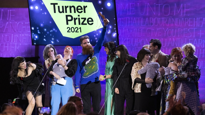 Members of the Array Collective accepting their award on stage at Coventry Cathedral