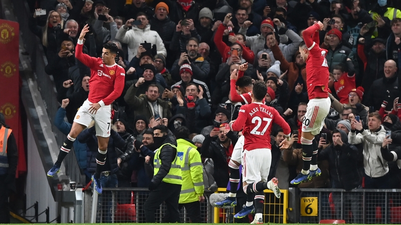 Cristiano Ronaldo (L) celebrates his 801st career goal